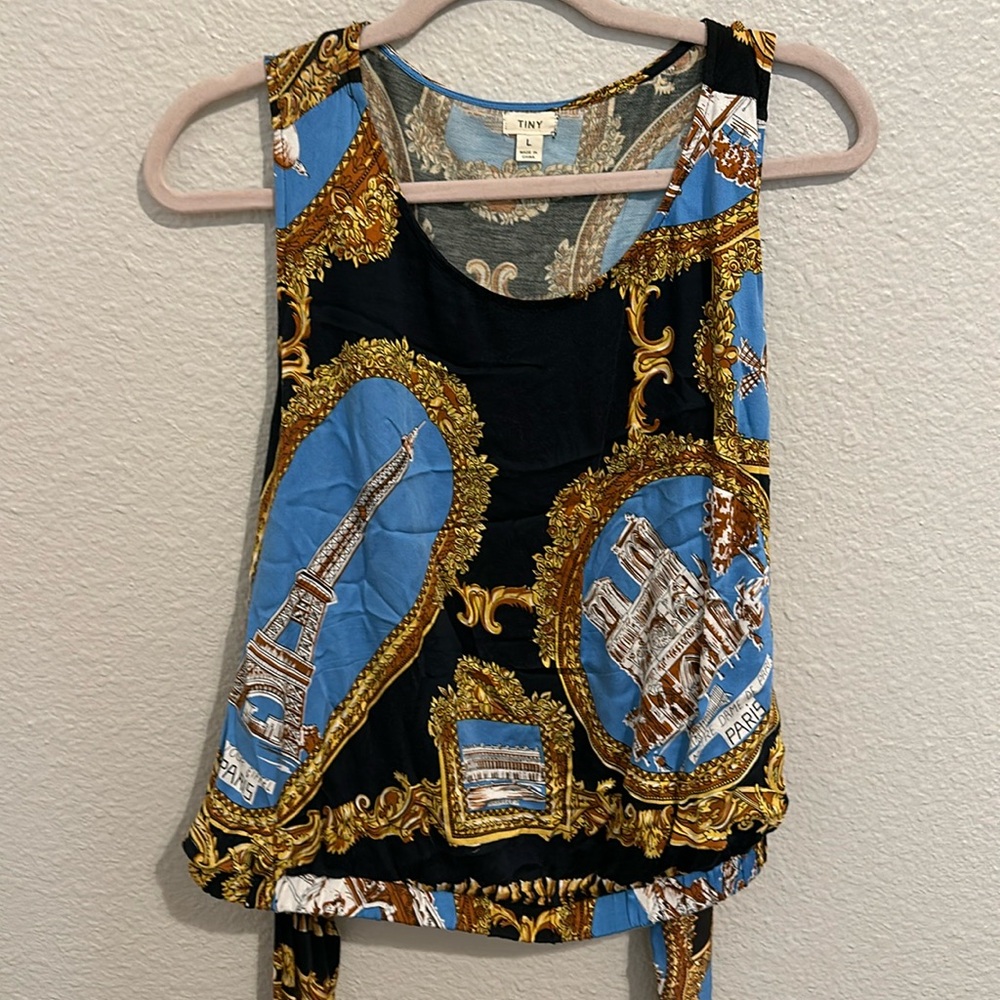 Silky soft top with elastic waist and tie. Size L